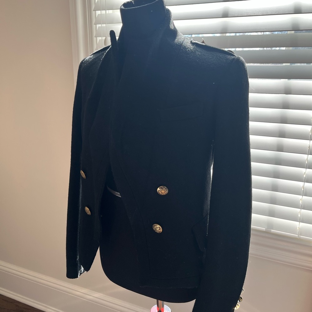 Great Tailored jacket with gold button details.